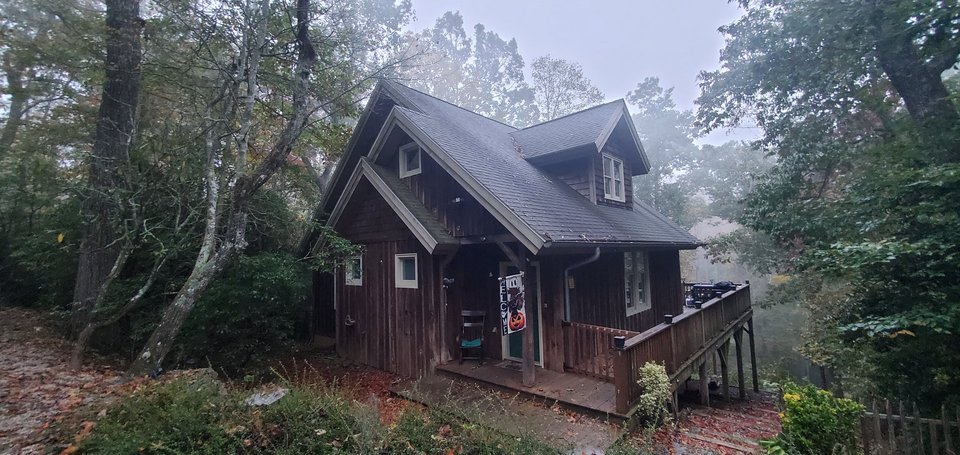 Cabin in misty mountain morning